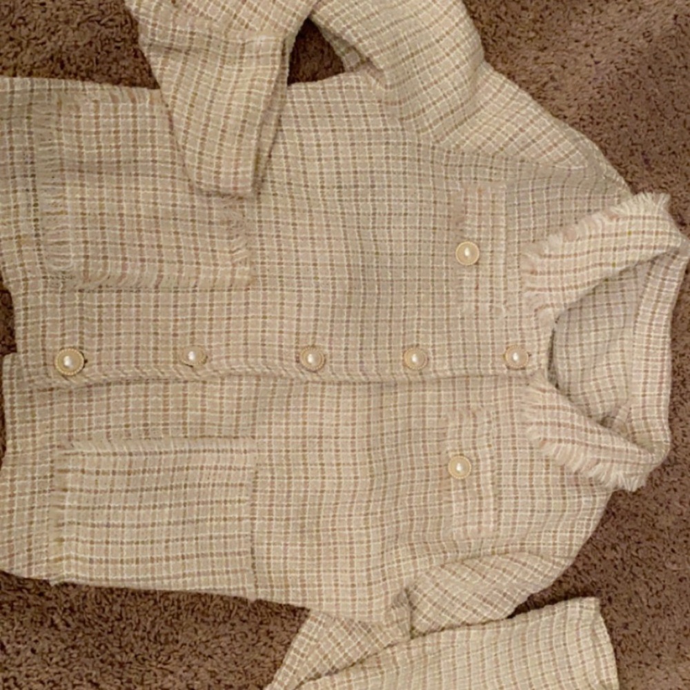 Cute button up jacket. Washed but Never worn Pairs well with tank, jeans & heels